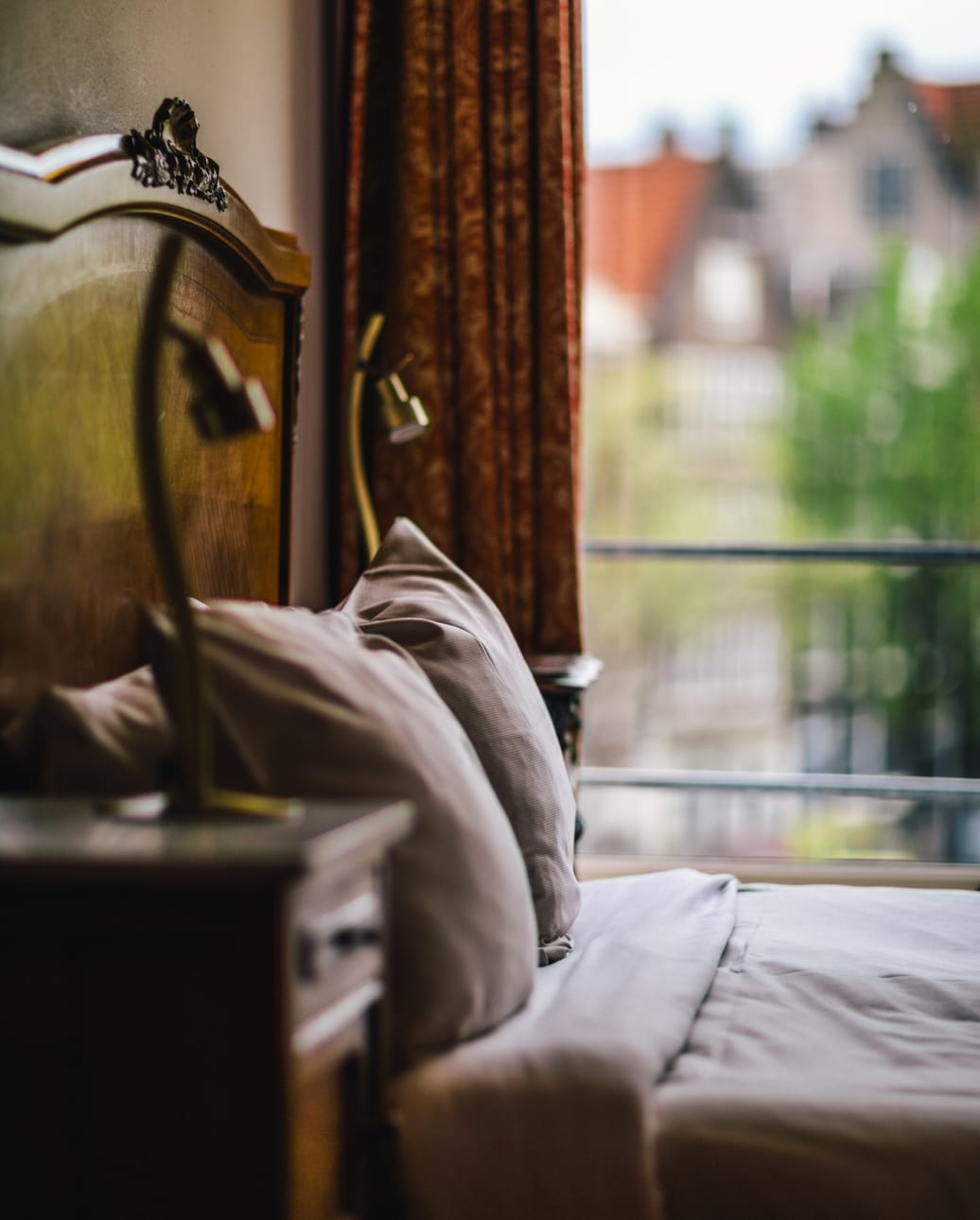Hotel bedroom with a canal view through the window